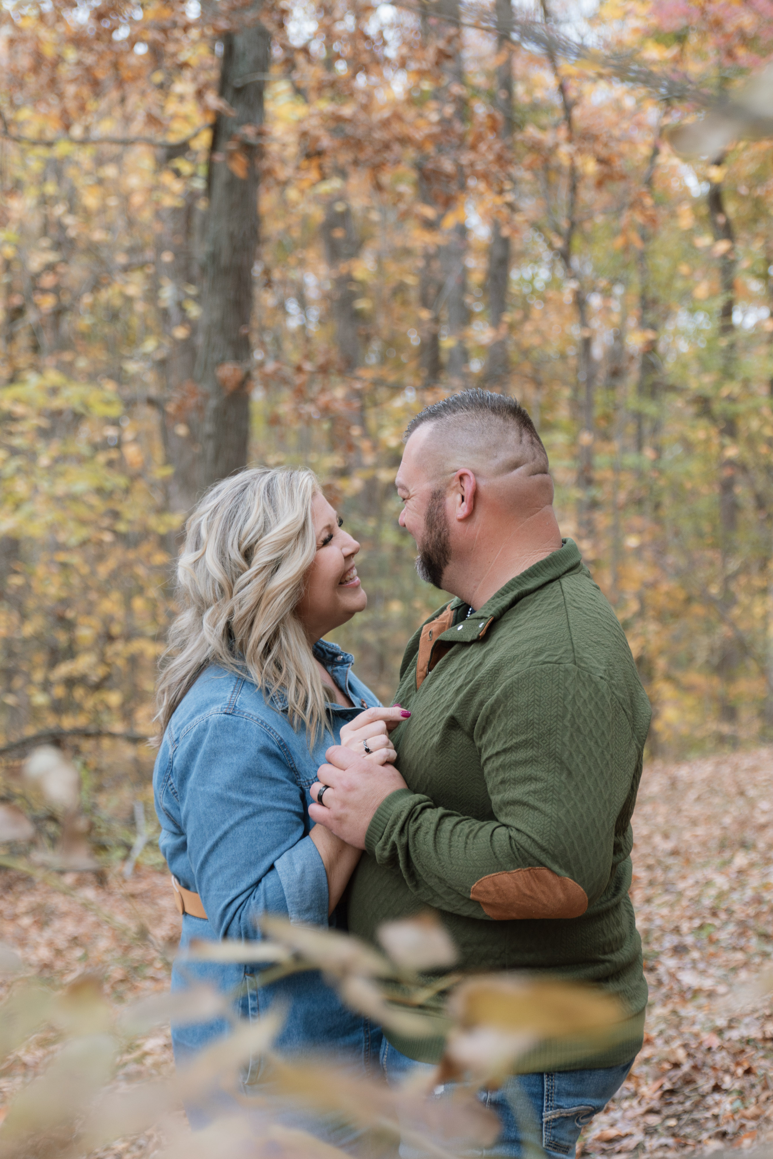 Couple on porch swing at their camper home