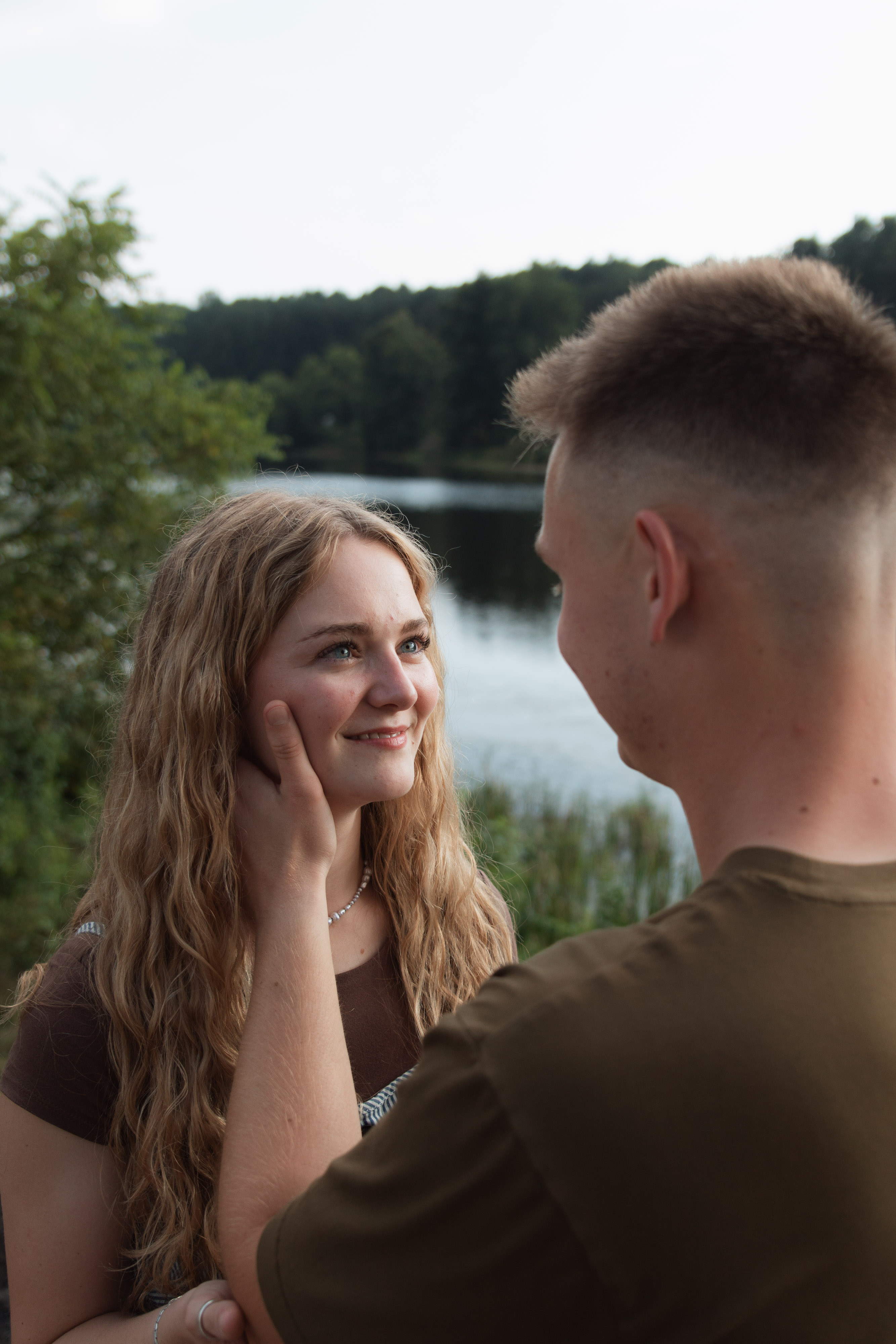 Couple embracing during session at Bernheim Forest